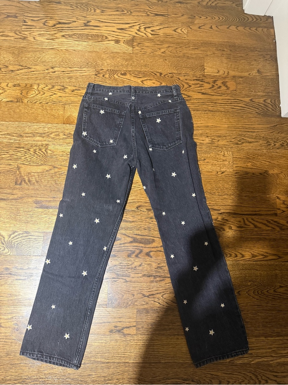 Reformation Black High-Rise Jeans with White Daisy Embroidery